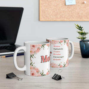 This 11 ounce mug has the word Mother and is adorned with beautiful words that describe your mom's personality, such as optimistic, tender, heroine, encourager, and reliable. It also has flowers in pastel pinks and greens around the wording on mug.