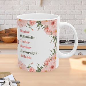 This 11 ounce mug has the word Mother and is adorned with beautiful words that describe your mom's personality, such as optimistic, tender, heroine, encourager, and reliable. It also has flowers in pastel pinks and greens around the wording on mug.