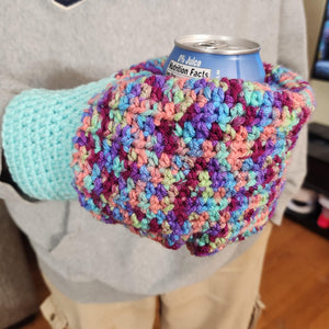 hand knit mitten with closed bottom which is used to hold a cold can in the winter.  variegated colors from light blues to maroon