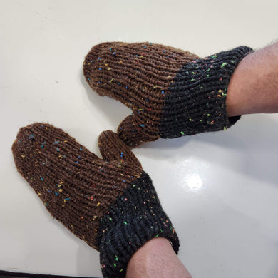 knit mittens with brown hand area and black cuffs.  These gloves have specks of bright colors of many colors throughout  the entirety of the mittens