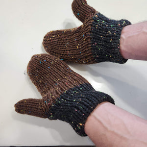 knit mittens with brown hand area and black cuffs. These gloves have specks of bright colors of many colors throughout the entirety of the mittens