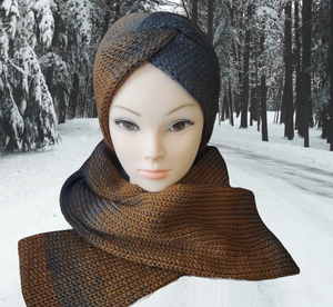 Messy bun ear warmer and scarf set in colors moving from black to brown displayed on a manikin with a snowy woodland background