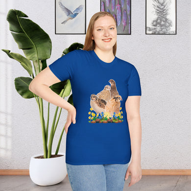 A girl wearing a Royal Blue T-shirt. This is a unique and stylish piece of clothing that features a beautifully detailed illustration of a Coturnix Quail. The illustration is printed in a natural brown hue, giving the shirt a rustic and earthy feel with colorful flowers.