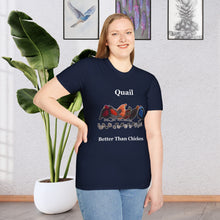 A Girl standing in a room with a plant and paintings on the wall wearing a Navy Blue t-shirt that says Quail Better Than Chicken on the front with a line of quail that look as if they are quilted in the front middle of the shirt