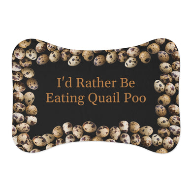 dog feeding mat is shaped like a bone and has a unique design with quail eggs arranged around the outer edges. The center of the mat features the text 