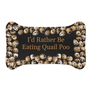dog feeding mat is shaped like a bone and has a unique design with quail eggs arranged around the outer edges. The center of the mat features the text "I would rather be eating quail poo" 