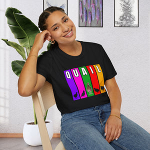 A girl seated in a chair by a plant wearing a Black T-Shirt features multi-color verticle stripes in Purple, Pink, Green, Red, and Yellow. Each vertical stripe has a letter of the word quail at the top, It has silhouettes of Coturnix Quail, along with one in full color that is standing tall in the center of the graphic.
