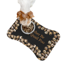 A cute dog eating from a bowl on a feeding mat is shaped like a bone and has a unique design with quail eggs arranged around the outer edges. The center of the mat features the text "I would rather be eating quail poo" 