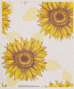 A Swedish dishcloth featuring large sunflowers on a beige background